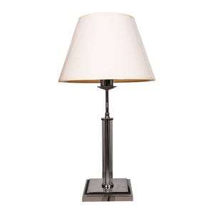 May include: A chrome table lamp with a white lampshade. The lamp has a square base and a cylindrical stem. The lampshade is a classic tapered shape. The lamp is designed for indoor use.
