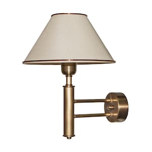 Könnte beinhalten: Eine Wandleuchte mit cremefarbenem Lampenschirm und einem Metallrahmen in Bronzefarbe. Der Lampenschirm hat eine konische Form mit braunem Rand. Der Arm der Lampe erstreckt sich von einer kreisförmigen Basis. Für Wandmontage.