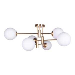 May include: A modern ceiling light fixture with a gold finish and six white globe shades. The fixture has a central mounting plate and arms extending outwards, each holding a globe. The design is minimalist and contemporary.