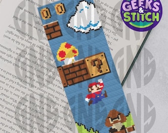 May include: A blue and brown pixel art bookmark featuring a character from the Super Mario Bros. video game. The bookmark shows Mario jumping over a question block and a mushroom, with a ghost floating in the sky above.