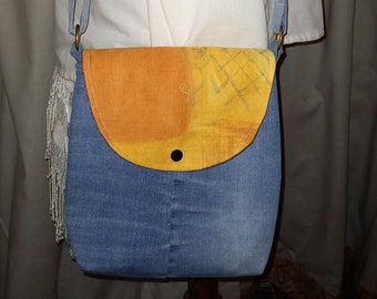 Clutch bag with shoulder strap and flap in recycled denim
