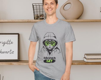 May include: A gray t-shirt with a black and white illustration of a cat wearing a hoodie and green sunglasses. The text "Hacker Cat" is printed in green below the cat.