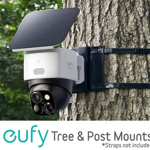May include: A white and black security camera with a solar panel attached, mounted on a tree. The camera has three lenses and is secured with black straps. The text "eufy Tree & Post Mounts" is displayed below the camera.