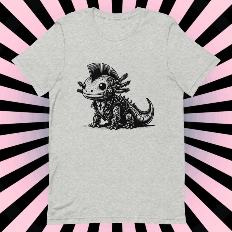 K&ouml;nnte beinhalten: Ein graues T-Shirt mit einer Schwarzwei&szlig;-Illustration eines Punk-Axolotl, das eine Lederjacke tr&auml;gt. Das Axolotl hat einen Irokesenschnitt und tr&auml;gt ein Nietenhalsband.