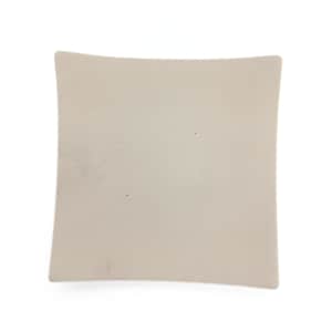 May include: A plain white ceramic square plate with slightly rounded edges.