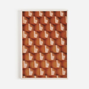 May include: A close-up of a wall made of orange bricks with a repeating pattern of white L-shapes.