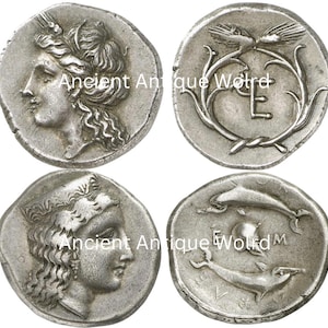 May include: Four silver ancient coins. Two coins feature a profile of a woman's face with a laurel wreath. The other two coins have designs of birds, an 'E', and dolphins. The text "Ancient Antique World" is visible.