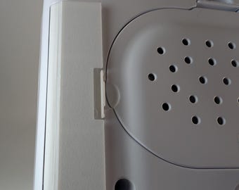 Tapa de batería: compatible con el alimentador de microchip SureFeed (versiones estándar y con eliminador de batería)