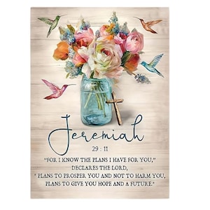 May include: A floral arrangement with pink, white and orange flowers in a blue mason jar with a wooden cross. The background is a light wood grain. The text "Jeremiah 29:11" is below the jar. The quote "For I know the plans I have for you," declares the Lord, "Plans to prosper you and not to harm you, plans to give you hope and a future." is below the text.