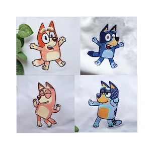 May include: Four embroidered patches featuring cartoon dog characters in various poses. The patches showcase the characters in shades of blue, pink, and orange, with black outlines. Each patch is on a white background, with a few green leaves visible.