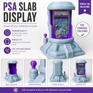 May include: A light gray PSA slab display with purple accents, designed to showcase graded cards. The display features the text "PSA SLAB DISPLAY" and "Show off your collection in style". It is designed for serious collectors.