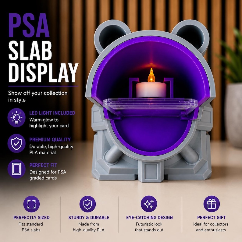 May include: A gray and purple PSA slab display with a built-in LED light. The display has a futuristic design and is designed to showcase graded cards. The text on the display reads "PSA SLAB DISPLAY".