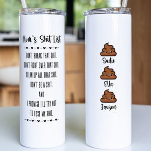 May include: Two white stainless steel tumblers with lids and straws. The tumbler on the left has the text "Mom's Shit List" and a list of rules. The tumbler on the right has three poop emojis with the names Sadie, Ella, and Jaxson.