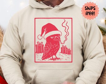Smoking Crow Christmas Sweatshirt, Lino Cut Style Santa Crow with Cigarette Hoodie, Holiday Bird Lover Gift; add custom sleeve