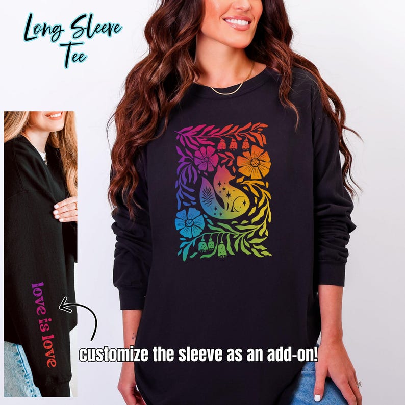 May include: Black long-sleeved tee featuring a colourful rainbow floral and fox design. The sleeve can be customised. The text "love is love" is printed on the left sleeve. The words "Long Sleeve Tee" are at the top.