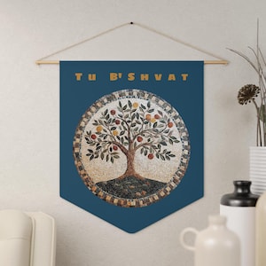 May include: A blue banner with the text "Tu B'Shvat" in gold letters. A mosaic of a tree with fruit is in the center of the banner.