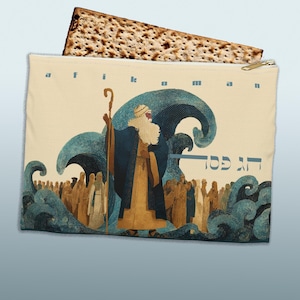 May include: A beige zippered pouch with an illustration of a biblical scene, featuring a figure with a staff and a crowd, with blue waves and text. A piece of matzah bread is partially visible. The text on the pouch reads "Afikoman" and "חג פסח".