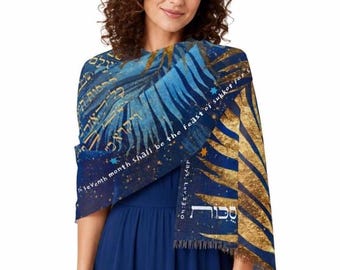 May include: A blue and gold rectangular shawl featuring a printed design of palm fronds, stars, and Hebrew text. The fabric includes the English text: The seventh month shall be the feast of Sukkot for seven days, Lev 23:40, and the Hebrew word Sukkot.