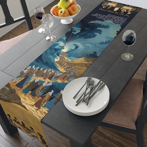 May include: A decorative table runner featuring a biblical scene with figures in robes, a large wave, and text. The runner is on a dark wooden table, with plates, silverware, and wine glasses. A bowl of apples sits nearby.