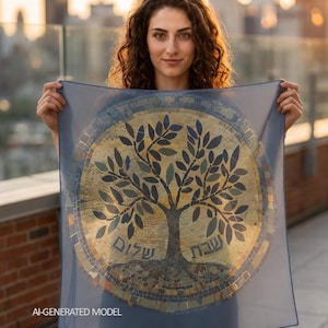May include: A square, semi-sheer, slate blue scarf featuring a central circular mosaic design of a tree with dark leaves and roots. The mosaic includes gold and brown tones with Hebrew text inscribed on the left and right sides of the tree trunk.