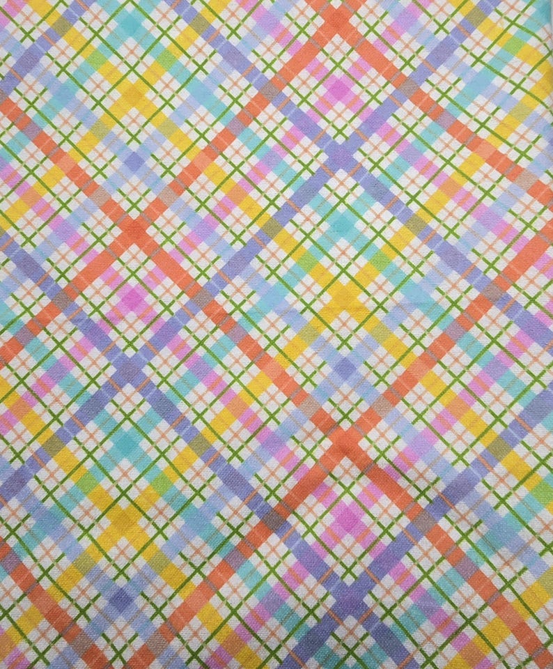 May include: A colorful plaid fabric with a repeating pattern of intersecting lines. The design features a mix of pastel colors, including orange, yellow, green, blue, pink, and purple, creating a vibrant and cheerful aesthetic. The fabric has a white background.