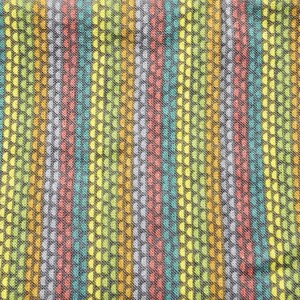 May include: Textile with a vertical striped pattern. The stripes alternate in color, including yellow, green, red, and blue. The fabric has a textured appearance, with small, repeating dot-like patterns.