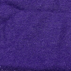 May include: Close-up of a deep purple fabric with a textured, woven appearance. The material has a slightly uneven surface, with subtle variations in color and texture. The fabric appears to be a textile.