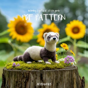 May include: A crocheted ferret with brown and cream-colored fur sits on a mossy tree stump, surrounded by yellow sunflowers and wildflowers. The image includes the text "PDF PATTERN" and "Including 3 gifts & stitch guide". The ArtisanPals logo is at the bottom.