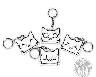 May include: Four white cat-shaped keychains with different facial expressions. Each keychain has a silver chain and ring. The keychains are arranged in a circle on a white background.
