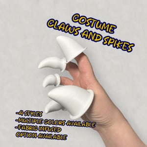 May include: White plastic costume claws and spikes for fingers. The claws are in various sizes and shapes. The text "COSTUME CLAWS AND SPIKES" is written in yellow letters on a blue background. The text "4 STYLES", "MULTIPLE COLORS AVAILABLE", "FABRIC INFUSED OPTION AVAILABLE" is written in black letters on a white background.