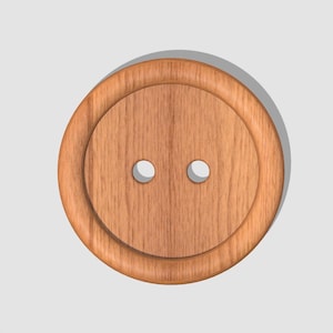 Puede incluir: Un botón de madera con dos agujeros. El botón es de color marrón claro y tiene una superficie lisa y redondeada.