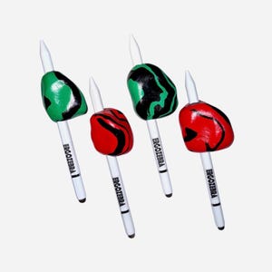 May include: Four white pens with the text ERGOZEBRA printed on the barrels. Each pen features a unique, irregularly shaped grip attachment in either a green and black marbled pattern or a red and black marbled pattern, with a pointed tip.