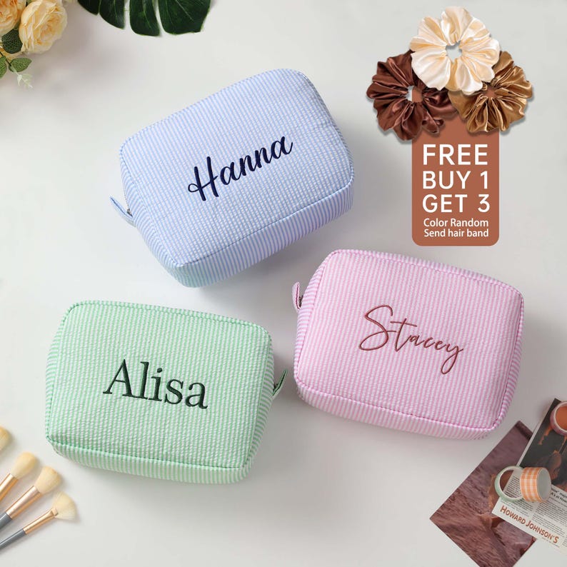 May include: Three personalized striped makeup bags in blue, green, and pink with the names Hanna, Alisa, and Stacey embroidered on them.  Free buy one get three offer with a random color hair band.