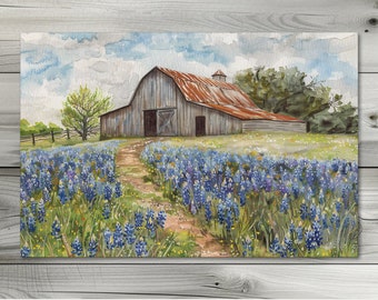 May include: Watercolor painting of a rustic barn with a rusty red roof, set against a backdrop of a bluebonnet field under a cloudy sky. A dirt path leads to the barn. The artwork is signed "Artemis Illumination Designs".
