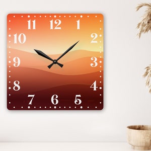 May include: Square wall clock with a sunset gradient background. The clock face has black hands and white numbers. The numbers are 1 through 12. The background is a gradient of orange, red, and brown.