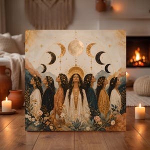 May include: A square canvas print featuring seven figures standing in a row, each wearing flowing robes in shades of white, black, blue, and gold. Above them, a golden moon cycle is depicted against a backdrop of mountains and floral accents.