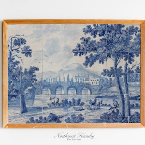 May include: Framed artwork with a blue and white landscape design, resembling traditional tile art. The image shows a bridge, trees, and figures, set within a wooden frame. The text "Northwest Foundry Fine Art Prints" is at the bottom.