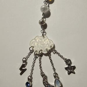 Charm para teléfono Tormentas dispersas