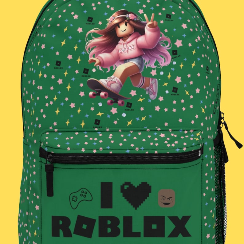 May include: Green backpack with a cartoon girl on a skateboard, pink stars, and the text "I love ROBLOX" with a video game controller and a heart.