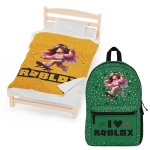 May include: A green backpack with a white and pink star pattern and the text "I love Roblox" on the front. The backpack features a cartoon girl on a skateboard. A yellow blanket with a cartoon girl on a skateboard and the text "Roblox" is also shown.