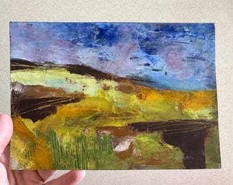 May include: Abstract landscape painting with a blue sky, purple clouds, and brown, yellow, and green fields.