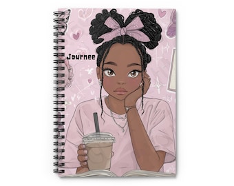 May include: Spiral-bound notebook featuring an illustration of a young Black woman with a pink bow, holding a coffee drink. The notebook cover is pink with hearts and butterflies, and the word "Journee" is printed on the cover.