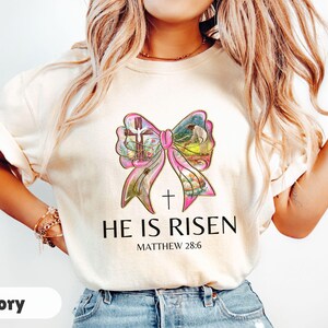He Is Risen, Christian T-shirt for Easter, Coquette Bow shirt, Womens Easter Shirt, He Has Rizzen, Easter Gift for Christian, Bible Verse