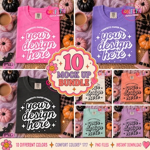 以下が含まれることがあります： ピンク、紫、黒、白、オレンジ、ミントなど、様々な色のComfort Colors 1717 Tシャツ10枚セット。各シャツには、白または黒の筆記体でyour design hereというテキストと星のアクセント、Confetti Paper Pressのロゴがプリントされています。
