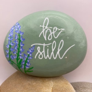 Be Still Hand Painted Rock, Lupine Painted Rock, Bible Verse Rock, Bible Painted Rocks, Religious Rocks, Be Still Rocks, Flower Rocks