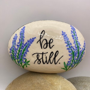 Be Still Hand Painted Rock, Lupine Painted Rock, Bible Verse Rock, Bible Painted Rocks, Religious Rocks, Be Still Rocks, Flower Rocks