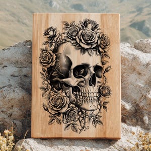 May include: A wooden plaque featuring a detailed black and white illustration of a human skull surrounded by roses. The skull is centered, with roses and vines forming a decorative border. The wood grain is visible.