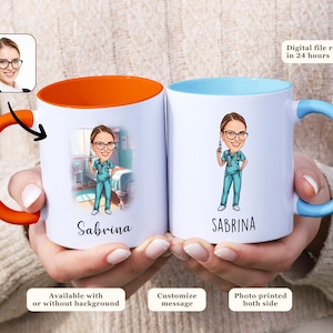 May include: Two white ceramic mugs with orange and blue handles. Both mugs feature a cartoon illustration of a nurse with a syringe and the name "Sabrina" printed below. The mug on the left has a cartoon image of a hospital room in the background. The mug on the right has a solid blue background.