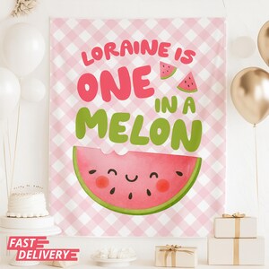 May include: A pink and white gingham backdrop with the text "LORAINNE IS ONE IN A MELON" in pink and green. A smiling watermelon slice is featured at the bottom. White and gold balloons and gift boxes are in the background.