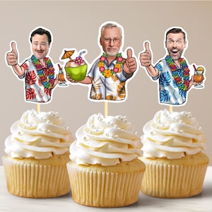May include: Three cupcakes decorated with images of men wearing Hawaiian shirts and holding tropical drinks. The cupcakes are white with white frosting and white sprinkles.